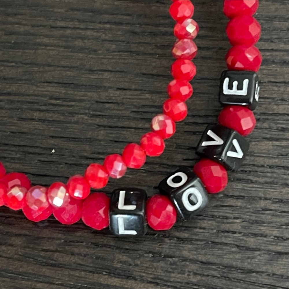 TWO RED BEADED CRYSTAL STRETCH LOVE BRACELETS WITH BLACK AND WHITE LETTERING. - Picture 3 of 5